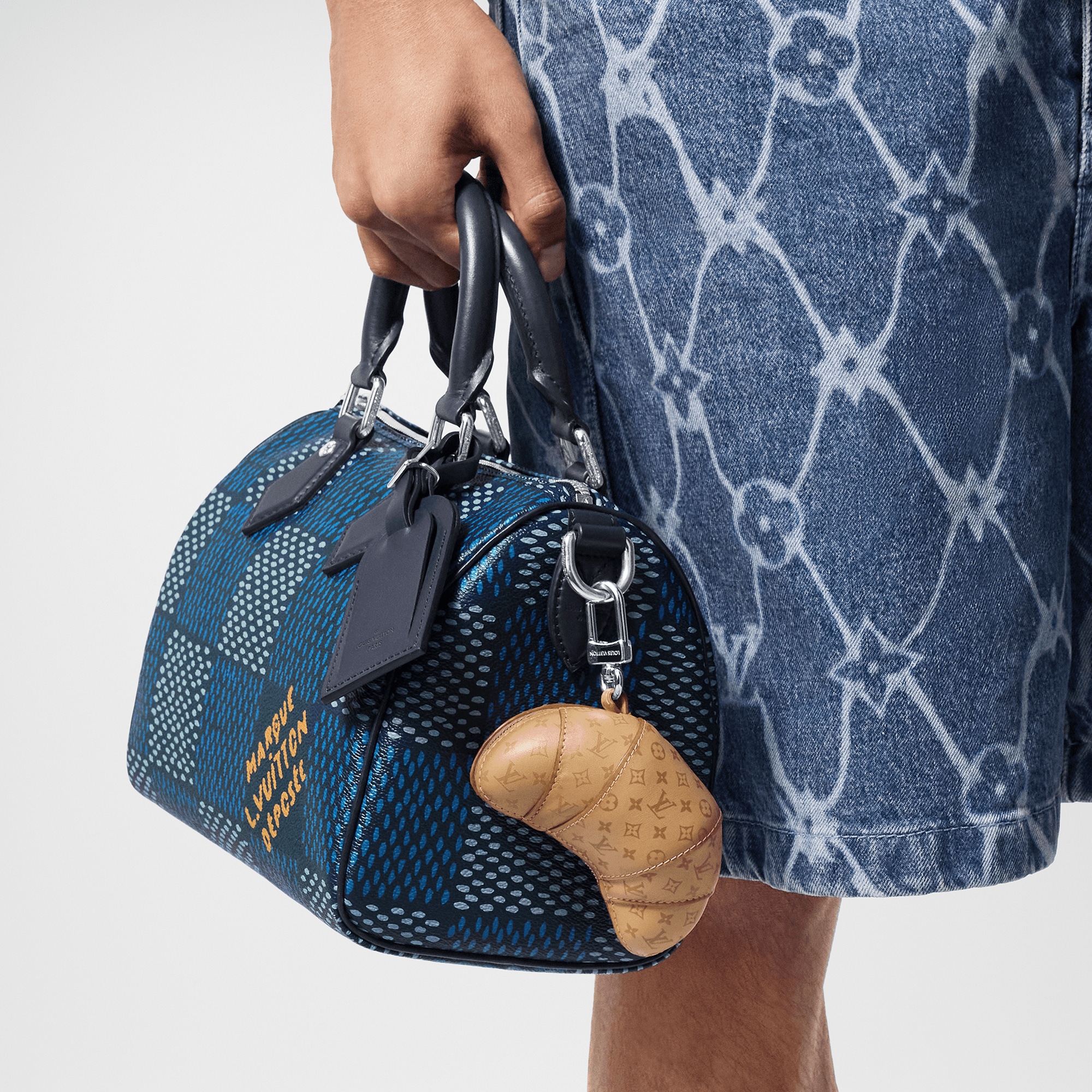 LV Croissant Bag Charm . in Men